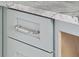 Close up of the elegant gray kitchen cabinets with sleek silver handles and marble countertops at 545 Towles Crossing Dr # 29455, Johns Island, SC 29455