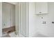 Well-lit laundry room with classic cabinets, doors, and modern fixtures for convenience at 545 Towles Crossing Dr # 29455, Johns Island, SC 29455