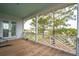 Spacious porch with a white railing and wooden flooring overlooking water at 545 Towles Crossing Dr # 29455, Johns Island, SC 29455