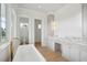 Bright bathroom showcasing a soaking tub and a modern vanity at 546 Towles Crossing Dr, Johns Island, SC 29455