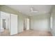 Bedroom featuring light green walls, wood floors, and multiple doorways at 546 Towles Crossing Dr, Johns Island, SC 29455