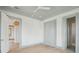 Spacious bedroom with ceiling fan, gray trim and an open door leading to another room at 546 Towles Crossing Dr, Johns Island, SC 29455