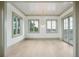 Bright bedroom with light green trim, wood floors, and a water view at 546 Towles Crossing Dr, Johns Island, SC 29455