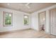 Bedroom featuring neutral paint, two windows and an open door to an ensuite bathroom at 546 Towles Crossing Dr, Johns Island, SC 29455