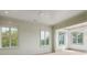 Bright bedroom with light green walls, wood floors, and multiple windows at 546 Towles Crossing Dr, Johns Island, SC 29455