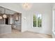 Open-concept dining room featuring a chandelier and a view of the modern kitchen at 546 Towles Crossing Dr, Johns Island, SC 29455