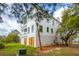 Exterior of a multi-story house showing the side with a palm tree in the front yard at 546 Towles Crossing Dr, Johns Island, SC 29455