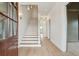 Bright foyer with hardwood flooring, a staircase, and elegant light fixtures at 546 Towles Crossing Dr, Johns Island, SC 29455