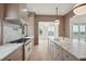 Open kitchen with island and marble countertops features a designer stove and high end finishes at 546 Towles Crossing Dr, Johns Island, SC 29455