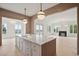 Kitchen island with marble countertop and views into bright, open living spaces at 546 Towles Crossing Dr, Johns Island, SC 29455