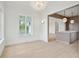 Bright living room views into the kitchen with a central marble-topped island at 546 Towles Crossing Dr, Johns Island, SC 29455