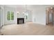 Bright living room boasts hardwood floors, a fireplace, and plenty of natural light at 546 Towles Crossing Dr, Johns Island, SC 29455