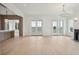 Open-concept living room with marble countertops and doors leading to an outdoor space at 546 Towles Crossing Dr, Johns Island, SC 29455