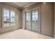 Bright living room with light wood floors and doors leading to outdoor balcony at 546 Towles Crossing Dr, Johns Island, SC 29455
