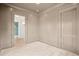 Bright living room with light wood floors and entry to another room at 546 Towles Crossing Dr, Johns Island, SC 29455
