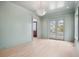 Stylish living room with door leading to outdoor balcony, chandelier, and neutral colors at 546 Towles Crossing Dr, Johns Island, SC 29455