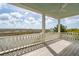 Stylish porch with white railing and lovely marsh views at 546 Towles Crossing Dr, Johns Island, SC 29455