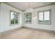 Bright, empty room with hardwood floors and green trim at 546 Towles Crossing Dr, Johns Island, SC 29455