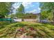 Beautiful backyard with green grass and a shed at 63 Guerry Cir, Goose Creek, SC 29445
