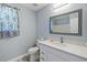 Bathroom featuring white vanity, framed mirror, and neutral colors at 63 Guerry Cir, Goose Creek, SC 29445