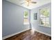 Comfortable bedroom featuring two windows, hardwood floors and a ceiling fan at 63 Guerry Cir, Goose Creek, SC 29445