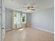 Sunny bedroom with tile floors, neutral paint, and natural light from the window at 63 Guerry Cir, Goose Creek, SC 29445