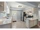 Modern kitchen featuring white cabinets, stainless steel appliances, and stylish backsplash at 63 Guerry Cir, Goose Creek, SC 29445