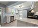 Well-lit kitchen with white cabinets, stainless steel dishwasher, and black appliances at 63 Guerry Cir, Goose Creek, SC 29445