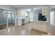 Bright kitchen with white cabinets, black appliances, and a sliding glass door at 63 Guerry Cir, Goose Creek, SC 29445