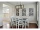 Dining room features an overhead chandelier and views to the backyard at 7638 Haywood St, North Charleston, SC 29418