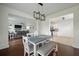 Dining area showcases a table with a bench and chairs, and access to both the kitchen and living room at 7638 Haywood St, North Charleston, SC 29418