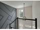 Staircase features metal railing and gray accent wall at 7638 Haywood St, North Charleston, SC 29418