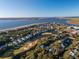 Breathtaking aerial view of coastal homes, lush greenery, and tranquil waterfront, showcasing the serene beauty of the community at 764 Summerwind Cir, Edisto Beach, SC 29438