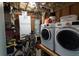 Basement storage room with washer, dryer, freezer, and shelving at 764 Summerwind Cir, Edisto Beach, SC 29438