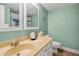Bathroom with double mirrors and under sink storage. Toilet to the right at 764 Summerwind Cir, Edisto Beach, SC 29438