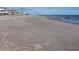 Expansive beach view with gentle waves meeting the shore, offering a serene and relaxing coastal experience near beautiful homes at 764 Summerwind Cir, Edisto Beach, SC 29438
