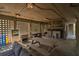 Ground level carport with outdoor seating, lighting and grilling area at 764 Summerwind Cir, Edisto Beach, SC 29438