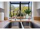 Kitchen sink with a window providing natural light and a view of the outdoors at 764 Summerwind Cir, Edisto Beach, SC 29438