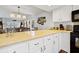 Open kitchen layout with countertop bar overlooking the living and dining areas at 764 Summerwind Cir, Edisto Beach, SC 29438