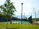 Outdoor basketball court with surrounding greenery and a clear sky backdrop at 766 Blueway Ave, Summerville, SC 29486