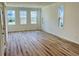 Bright and open living room with light wood flooring, white walls, and plenty of natural light at 766 Blueway Ave, Summerville, SC 29486