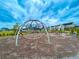 Community playground with climbing ropes and slides in a mulched area at 766 Blueway Ave, Summerville, SC 29486