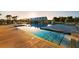 Stunning community pool with palm trees and a pool house offers a resort-like experience for residents at 766 Blueway Ave, Summerville, SC 29486