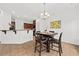 Bright dining area featuring a stylish chandelier, hardwood furniture, and easy access to the kitchen at 9652 Spencer Woods Rd, Ladson, SC 29456