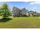 Residential street with suburban homes and well-manicured lawns at 9652 Spencer Woods Rd, Ladson, SC 29456