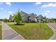 Residential street with suburban homes and well-manicured lawns at 9652 Spencer Woods Rd, Ladson, SC 29456
