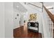 Bright foyer with hardwood floors, a staircase, and stylish decor enhancing the home's welcoming ambiance at 9652 Spencer Woods Rd, Ladson, SC 29456