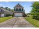 Inviting two-story home with a brick-accented facade, well-maintained landscaping, and a spacious driveway at 9652 Spencer Woods Rd, Ladson, SC 29456