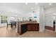 Bright, open kitchen with a breakfast bar, seamlessly connected to the dining and living areas at 9652 Spencer Woods Rd, Ladson, SC 29456