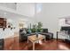 Open-concept living area with high ceilings, hardwood floors, and a seamless flow to the dining space at 9652 Spencer Woods Rd, Ladson, SC 29456